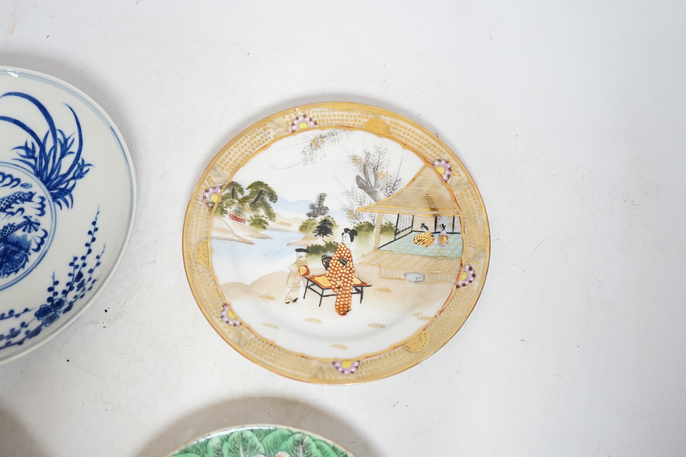 Four Chinese or Japanese porcelain saucers, largest 16.5 cm diameter